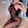 Woman wearing domila lace thong bodystocking, a seductive sheer mesh open-crotch stocking with lace detailing.