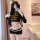A woman models a domila sexy lingerie set featuring an airline stewardess and police uniform costume, perfect for role play w...