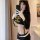 A woman models a domila sexy lingerie set featuring an airline stewardess and police uniform costume, perfect for role play w...