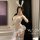Woman in white lace bunny lingerie with ears, sheer skirt, and blue bows—seductive yet playful sleepwear inspired by dominatr...