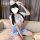 A person wearing a cute schoolgirl uniform set featuring a white crop top with blue accents, a matching mini skirt, and fluff...