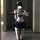 A person wearing a cute jk uniform, featuring a white lace bra with blue ribbon accents and a navy mini pleated skirt. the ou...