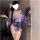 A woman models the domoira temptation lingerie set, featuring a deep v neckline and floral fox dream design inspired by japan...