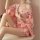 A woman wears a pink dorothy plus size japanese vintage kimono lingerie, featuring sheer sleeves and a sexy corset design wit...