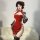A woman poses in a seductive red silk velvet cheongsam lingerie, featuring high slits and elegant design, perfect for a chine...