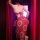 Woman wearing red dunhuang flying apsara lingerie set with gold-embossed sheer bra and skirt, back view.