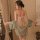 A woman models the dunhuang flying apsaras sheer lingerie set, featuring delicate floral patterns and flowing fabric, perfect...