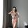 Woman wearing dva overwatch cosplay bodysuit with anime face print, taking mirror selfie in elf ears and lingerie set.