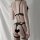 Woman wearing black dz gui ruo lingerie set with open-crotch design, butterfly knot back, and fishnet stockings.