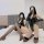 Two women pose on a bed wearing high-elastic shiny pu bodysuits, gloves, and stockings, perfect for nightclub or pole dance o...