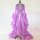 Elegant feather sleeve gown with sheer fabric and dramatic train, perfect for evening wear or sleepwear sets featuring luxuri...