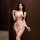 Woman wearing elegant lace bodysuit with floral mesh corset design and adjustable straps, showcasing sexy shapewear silhouett...