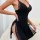 Woman wearing elegant black lace chemise nightgown with sexy split-slit design, romantic lingerie for women.