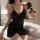 Elegant black satin tie-back sleep dress with v-neckline and lace trim, perfect for cozy nights.