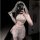 Woman wearing elegant white bridal lingerie set with sheer chiffon, lace details, and veil for sensual wedding night.