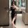 Woman in black lace backless split dress holding fan, elegant party cosplay outfit by eruru factory direct.