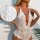 Woman wearing white lace bodysuit with deep v-neck, split cups and satin bows. sheer lingerie for curvy figures.