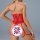 Woman wearing red lace lingerie set with sheer panels and garter straps, back view showing intricate design.
