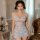 Woman wearing european-style lace sheer slip dress with floral print, elegant mesh camisole nightgown for intimate wear.