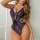 Woman wearing european sexy lace lingerie set - sheer mesh sleepwear with purple leaf pattern and black trim.