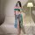 A woman poses in an exotic dance-inspired sleep set featuring a blue bodice and flowing skirt, embodying ancient chinese pala...