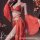 Exotic princess vintage-inspired lingerie set featuring a red sequined bodice with gold accents and a flowing lace skirt, per...