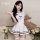 A woman models a domoira sexy lingerie set, featuring an innocent jk sailor style costume with maid and cosplay elements, per...