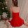 A woman sits on a bed wearing a red velvet christmas-themed lingerie set, featuring a festive design perfect for holiday part...