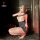 Woman posing in fei niao kui yue lace lingerie set with open-crotch design, sheer top, garter stockings, and heels for date n...