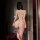 Woman wearing fei niao kui yue sheer lace lingerie set, back view showing sexy moonbird costume for small busts.