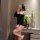 Woman wearing black fei niao moon gaze lingerie set, posing with phone in mirror. sheer bodycon midi dress with off-shoulder ...