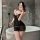 Woman in bathroom wearing feiniao moon gazer sexy lace sleepwear set with sheer camisole and matching briefs, holding phone a...
