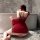 Woman in red feiniao moon-gazing hanfu lingerie set, silk doudou with sheer sleeves, kneeling by bathtub.