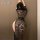 Woman wearing black misty flame lace secretary sleep dress, sheer seductive lingerie with floral pattern, back view.