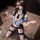 Woman in flirty lace nursing bra set with front clasp, sheer stockings, and secretary-style uniform, kneeling on marble floor...