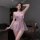 Woman wearing flirty lace sexy lingerie set – sheer peek-a-boo sleepwear with bows, seductive nightgown for intimate moments.