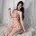 A woman poses elegantly in a floral deep v lace bodysuit, featuring delicate floral patterns and sheer mesh fabric. the open-...