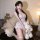 A woman poses with a plush rabbit, wearing a floral lace lingerie set featuring a low-cut design and push-up bodice, perfec...