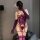 Woman wearing purple floral moon lace lingerie set with sheer back, long gloves, and thigh-highs in mirror selfie.