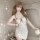 Woman wearing floral moonlight sensual lace bodycon sleep dress with red cherry print and thin straps, elegant bedroom linger...