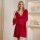 A woman models a french-inspired sexy sleep set featuring a deep red satin slip dress with lace detailing and a matching bral...