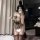French-style lace bodysuit for women featuring deep v plunge, crisscross strap design, sheer mesh, and cut-out details.