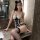 Woman modeling french lace bondage bodysuit with sheer panels, open-crotch, bare-back, and cheek-revealing design in bathroom...