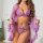 Woman wearing purple french lace chemise bra set with sheer embroidered details and matching robe.