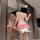 Woman wearing a pink french-style lace corset top with bow backless bralette and push-up cups, paired with a cherry cake dres...