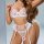 Woman modeling french style lace lingerie set with floral embroidery, featuring a sheer bra and garter belt for small bust en...