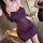 Woman in purple french lace sheer lingerie set with adjustable ties, holding wine glass in romantic vacation outfit.