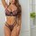Woman modeling french-style lingerie set with ultra-thin lace push-up bra and matching briefs, featuring floral embroidery an...