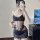 Woman wearing black sheer lace lingerie set with floral details and side ties, romantic french-style mesh bodysuit for sensua...