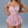 Woman wearing pink french-style sheer lace sleep dress with floral embroidery and bows, enhancing bust and featuring sensual ...
